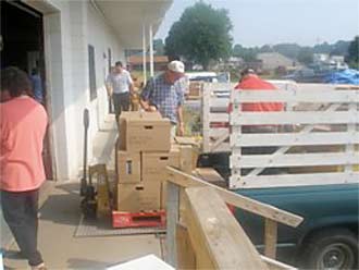 Loading goods at Project Sharing Warehouse